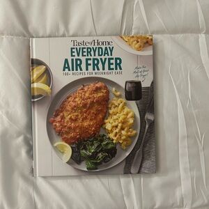 Taste of Home Air Fryer Cookbook with Green and Yellow Accents